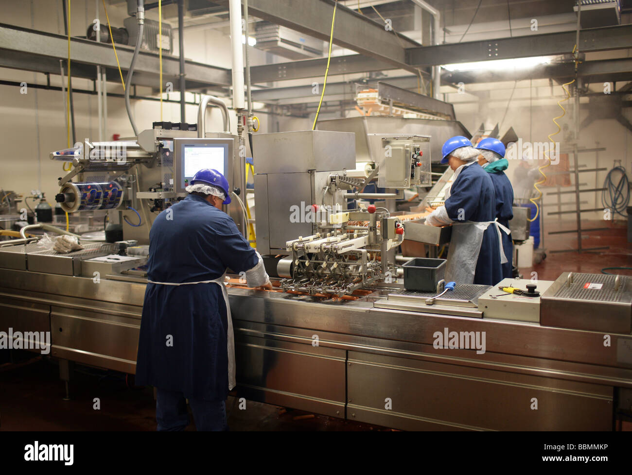 Workers at the Hummel Brothers Inc hot dog plant in New Haven CT USA Stock Photo