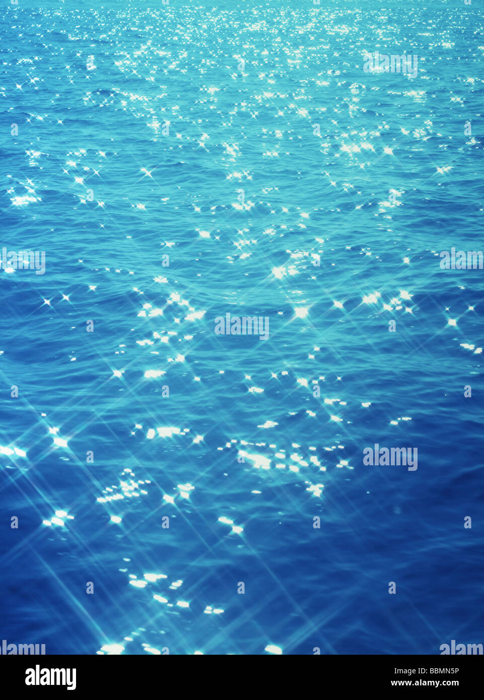 Close view of sunlight glittering on water surface Stock Photo - Alamy