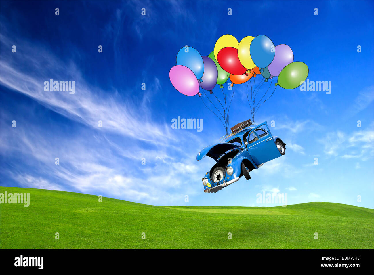 Beautiful beetle car with door s open falling from the sky with ballons Stock Photo