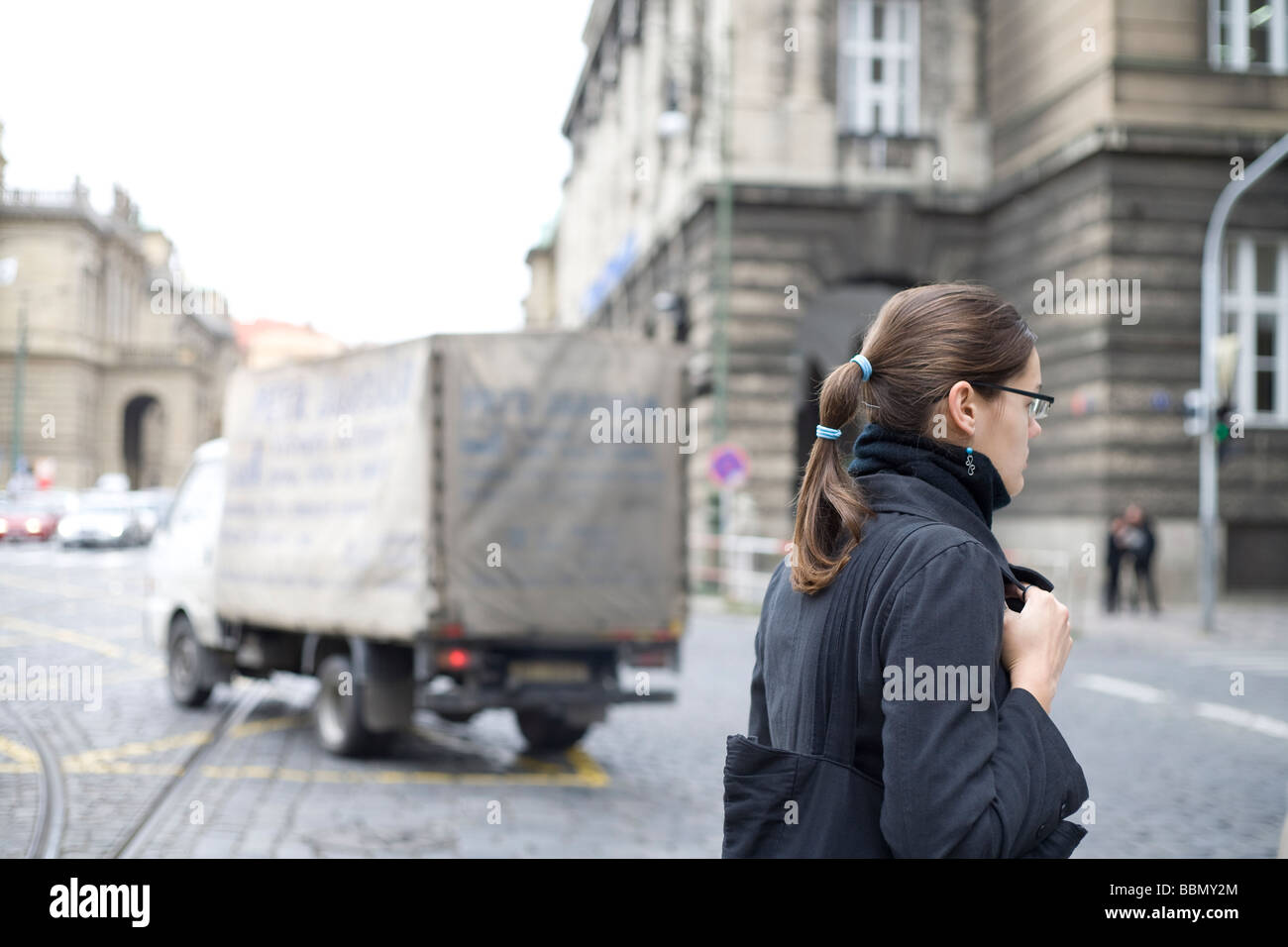 Woman crossing the street in Prague, Czech Republic Stock Photo - Alamy