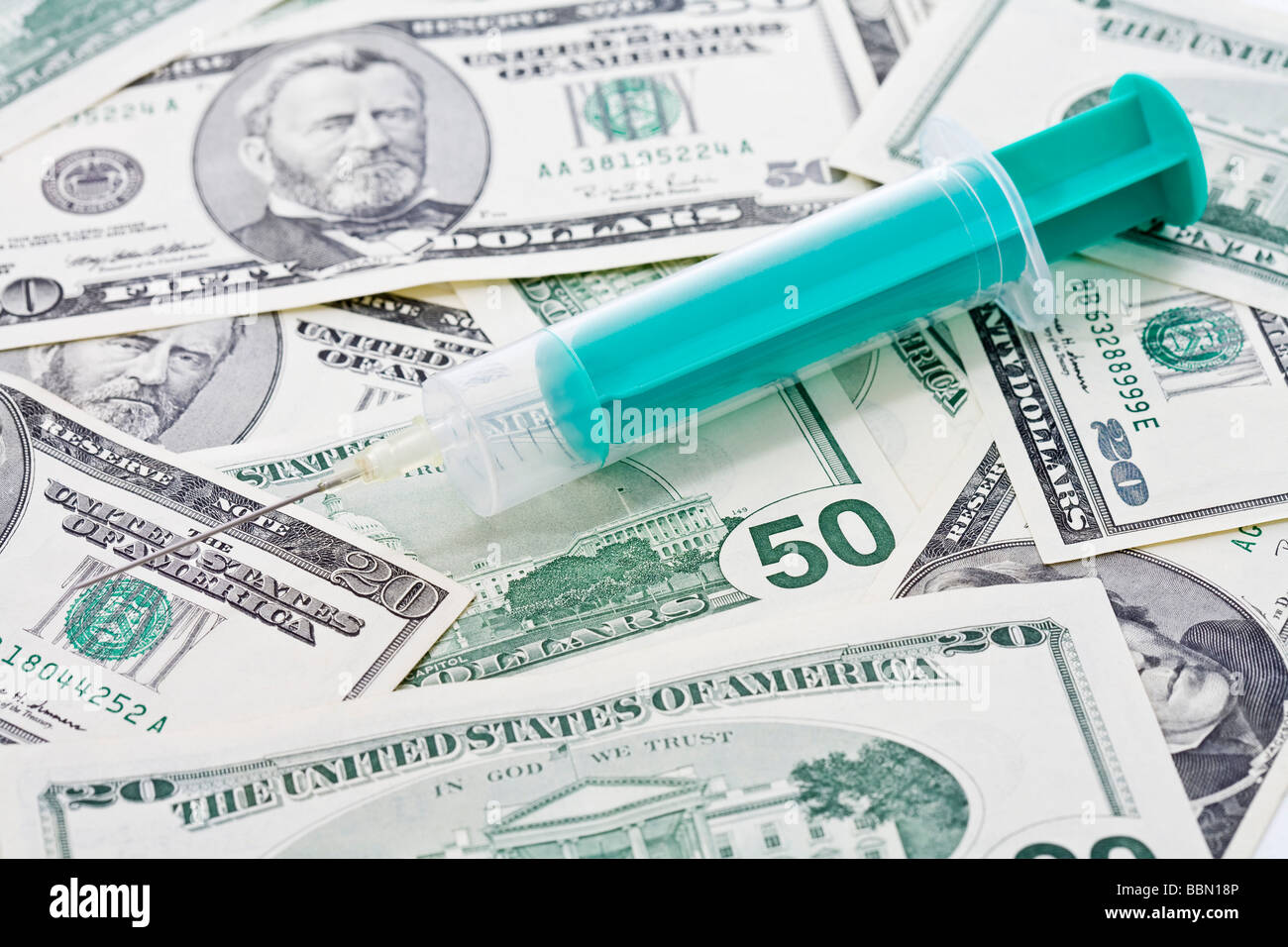 Us dollar bills syringe placed hires stock photography and images Alamy