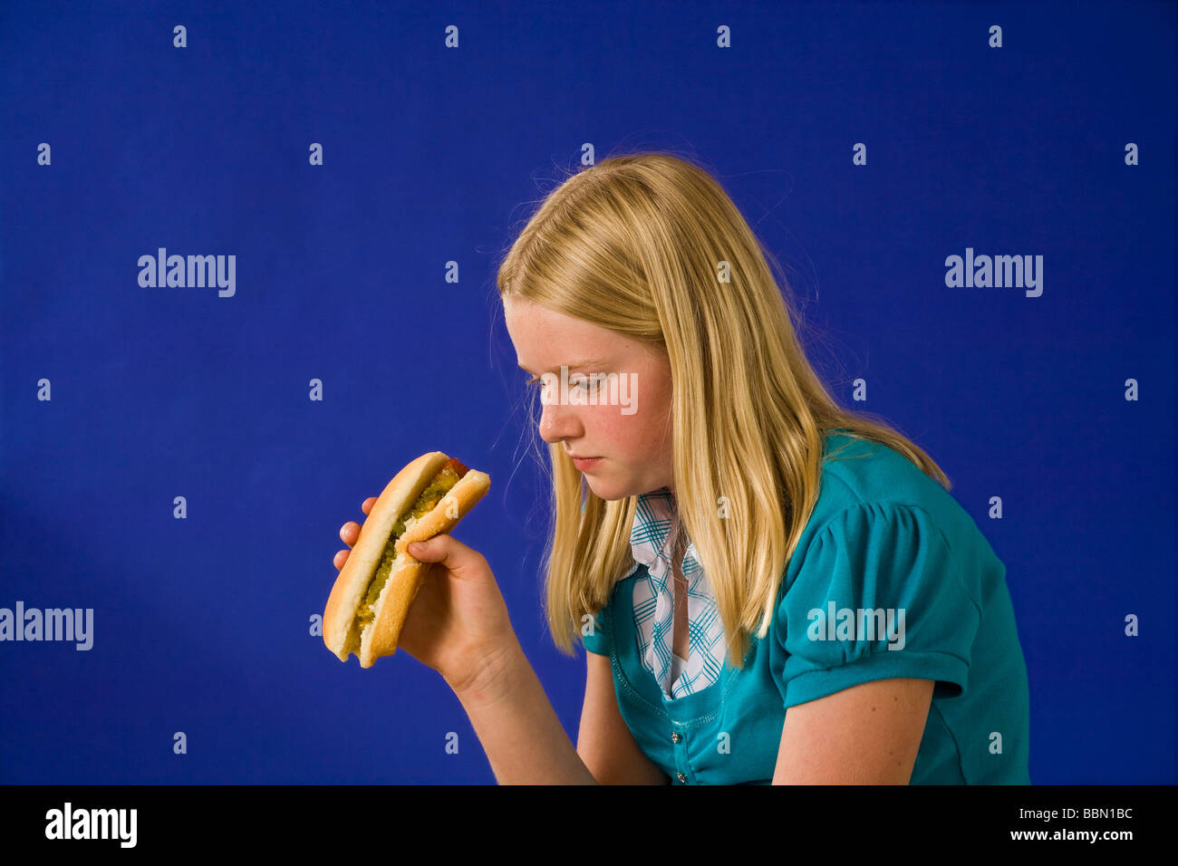 Portrait of young girl looking with disgust at a hotdog profile funny humorMR  © Myrleen Pearson Stock Photo
