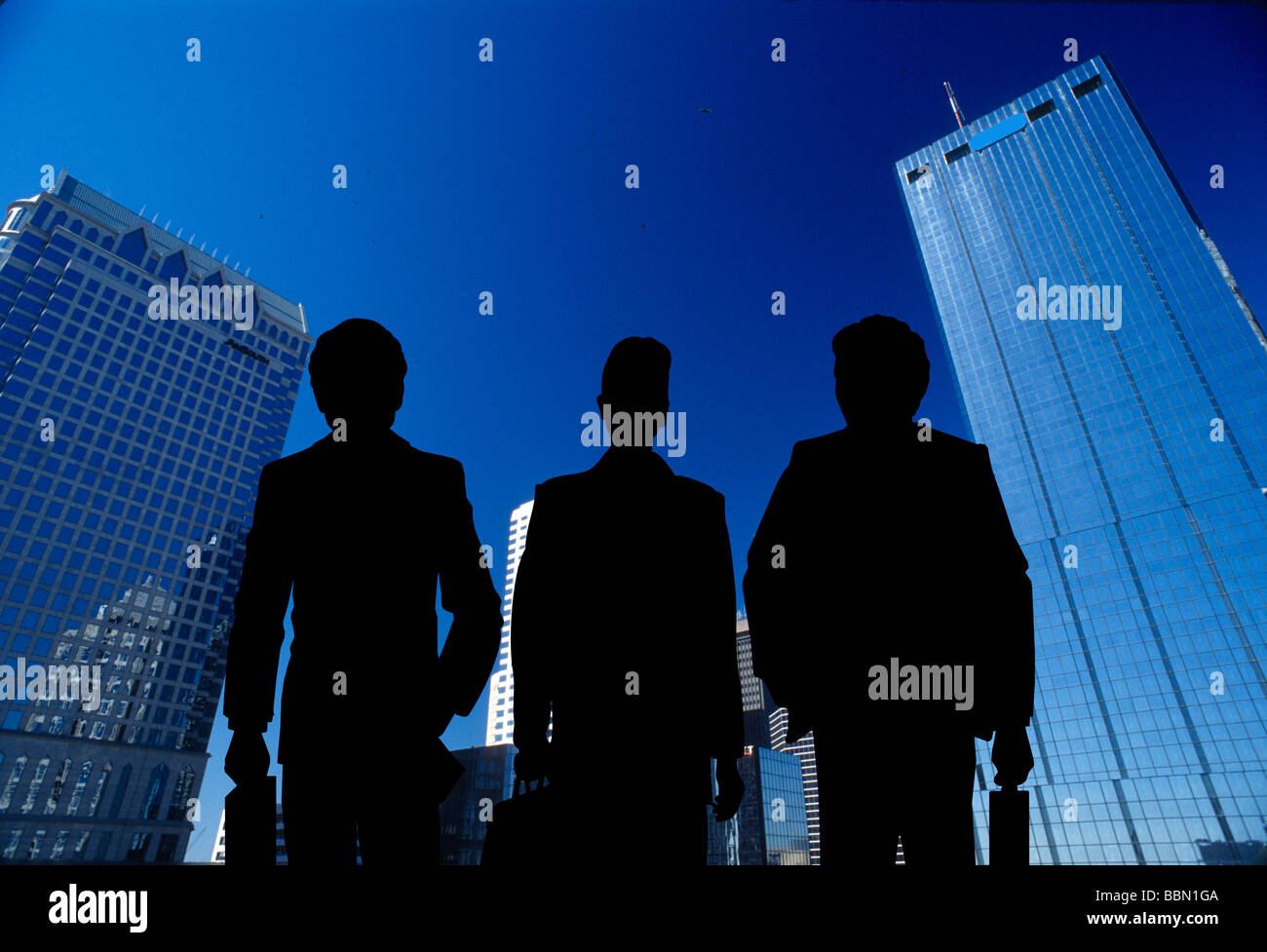 trio business people in large metropolitan city Stock Photo