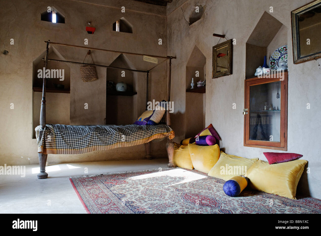 Traditional Arabian bedroom, historic adobe fortification Nakhl Fort or Castle, Hajar al Gharbi Mountains, Batinah Region, Sult Stock Photo
