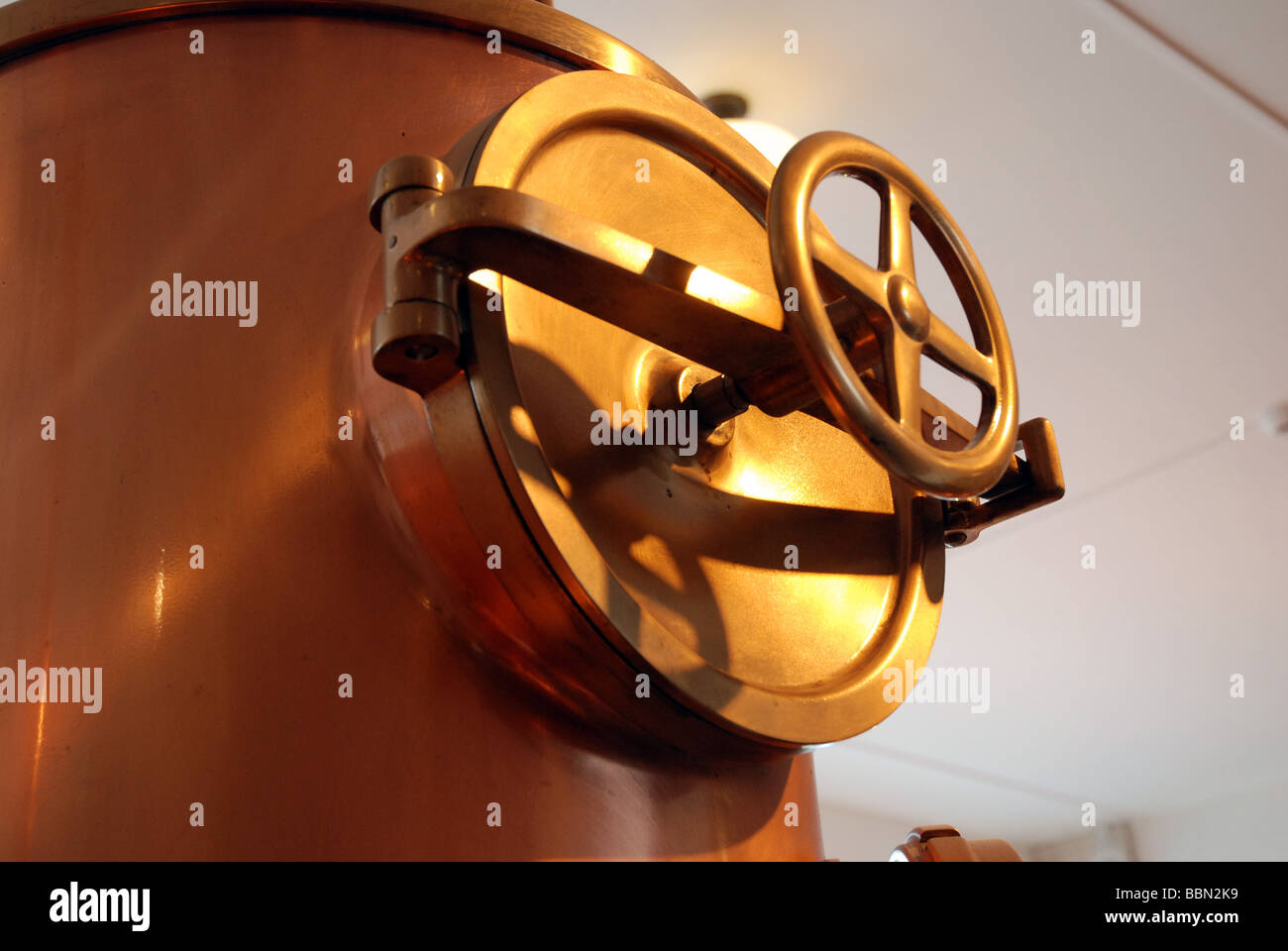 heineken experience amsterdam copper brass wheel valve brewing mash tun Stock Photo