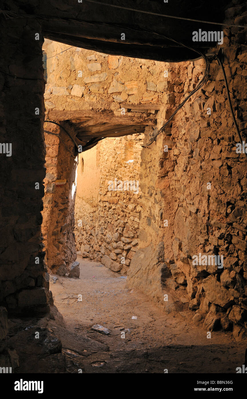 Cavelike alley at Misfah mountain oasis, Hajar al Gharbi Mountains, Dhakiliya Region, Sultanate of Oman, Arabia, Middle East Stock Photo