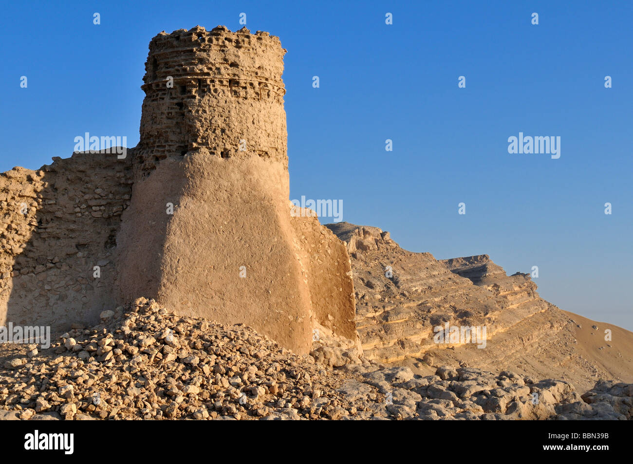 Ruin of the historic adobe city wall of Al Sulaif near Ibri, Hajar al Gharbi Mountains, Al Dhahirah Region, Sultanate of Oman,  Stock Photo