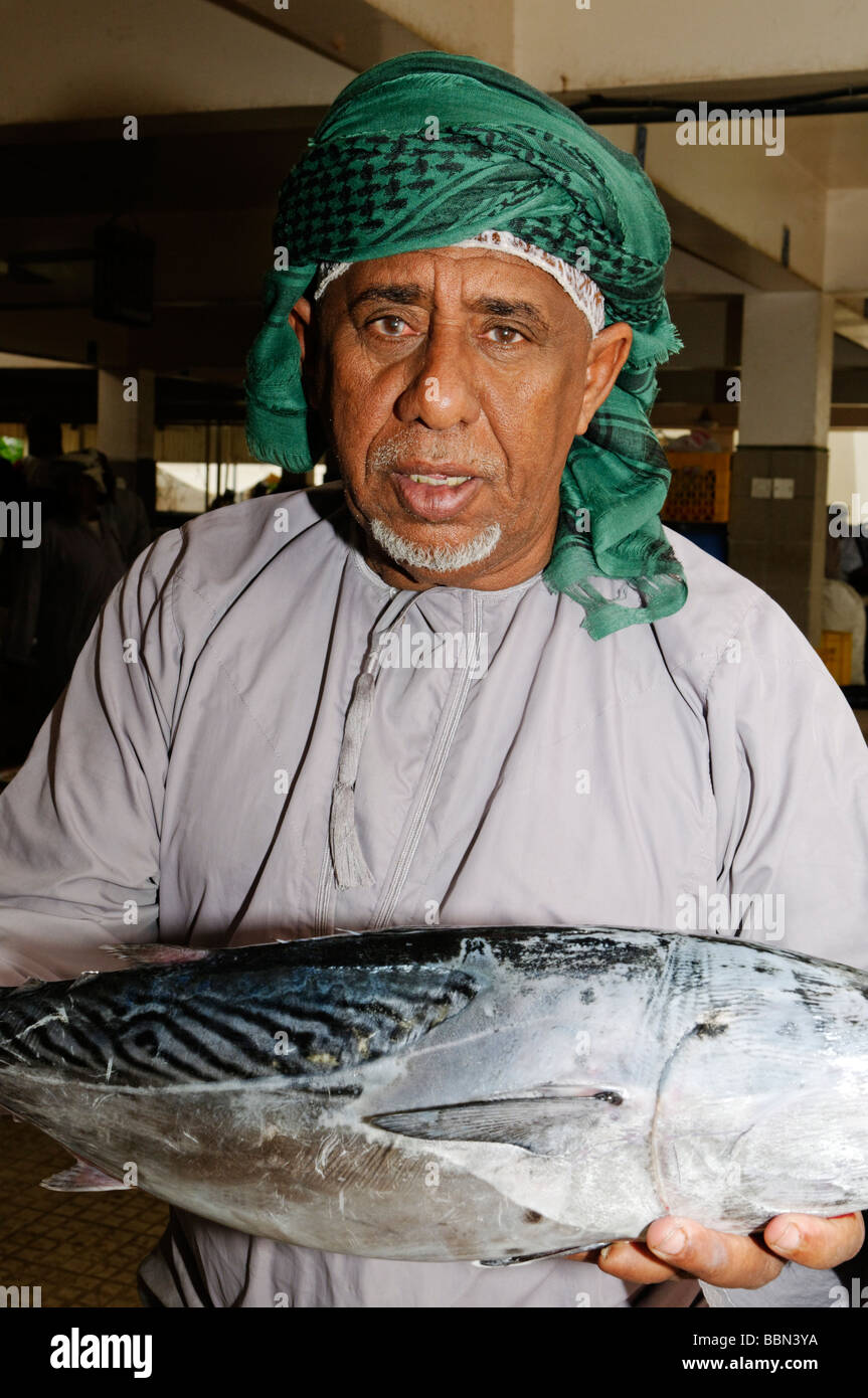 Omani fishmonger at Mutrah fishmarket, Muscat, Sultanate of Oman, Arabia, Middle East Stock Photo