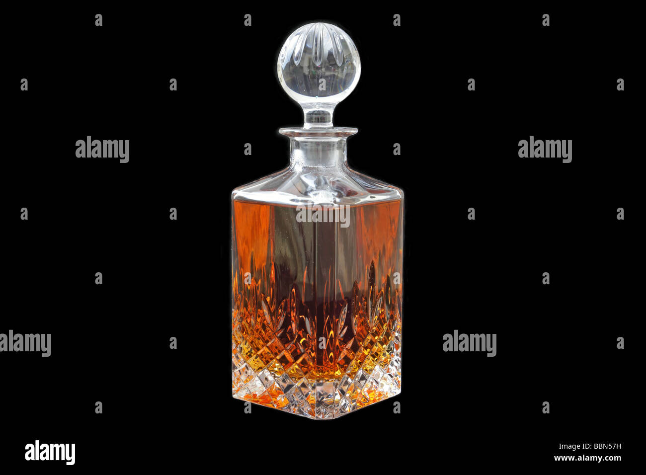 Crystal decanter filled with whiskey Stock Photo