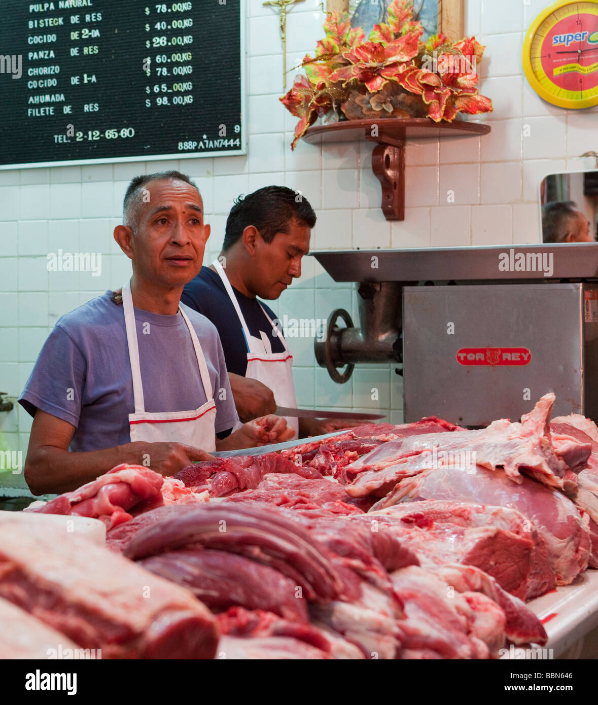 Butcher weighing meat on scale hi-res stock photography and images - Alamy