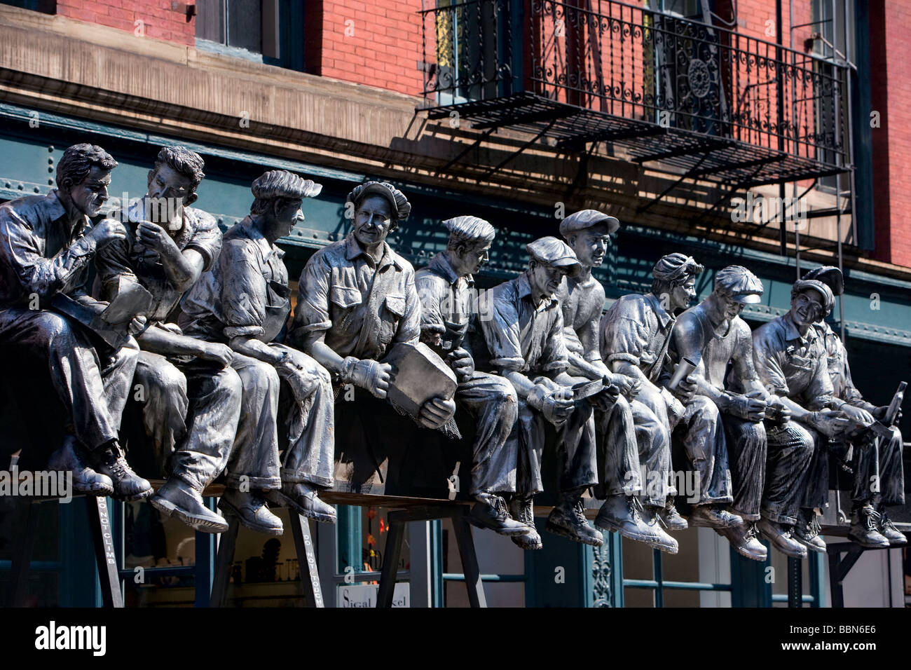 Iron workers sculpture by Sergio Furnari on the street in Manhattan, New York City, United States of America, North America. Stock Photo