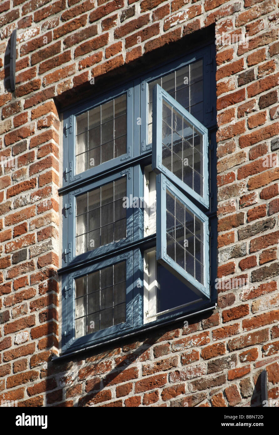 Lattice window on a Hanseatic red-brick house, Hanseatic city of Luebeck, Schleswig-Holstein, Germany, Europe Stock Photo
