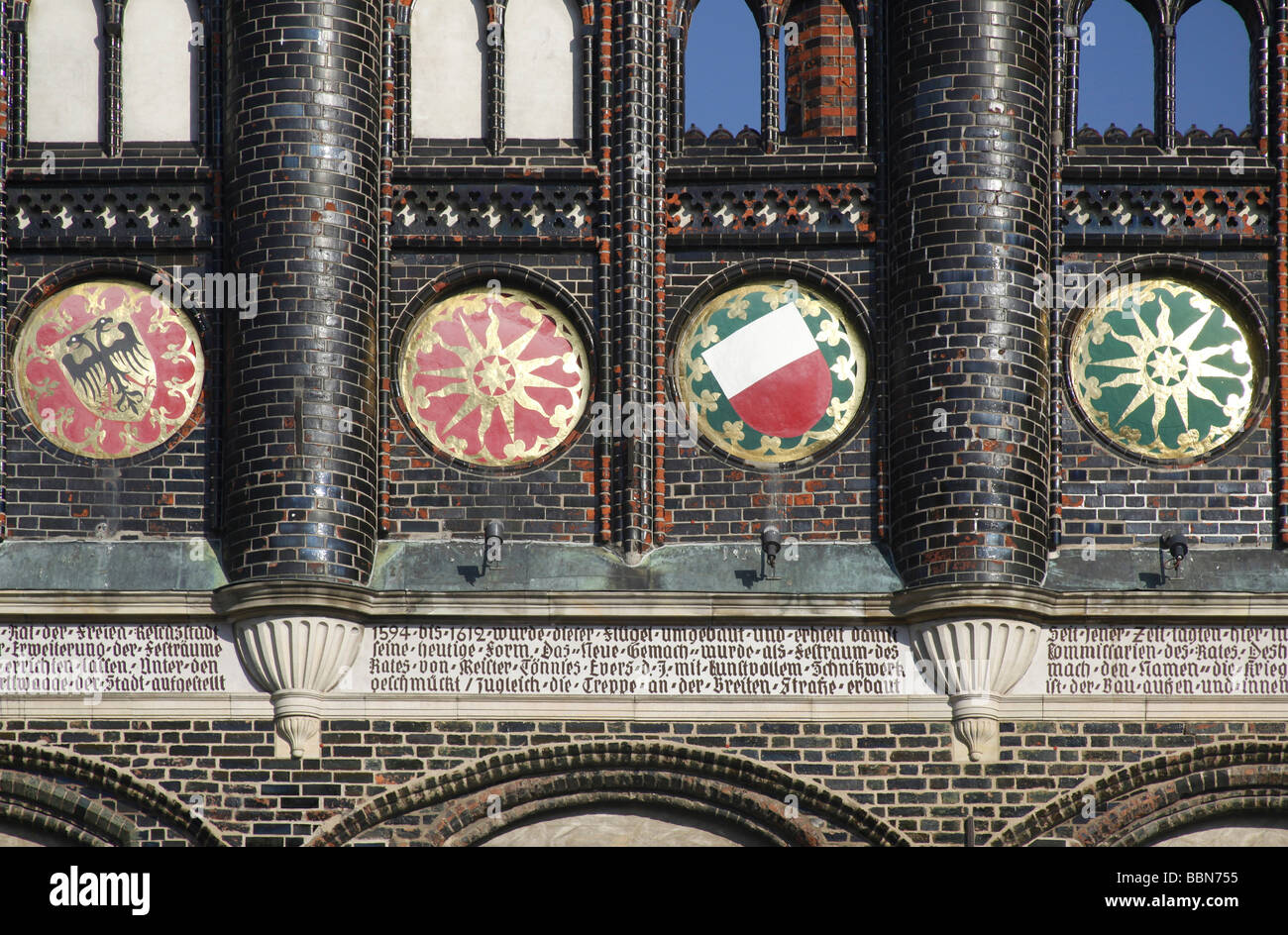 Facade detail of the town hall with coats of arms and inscription