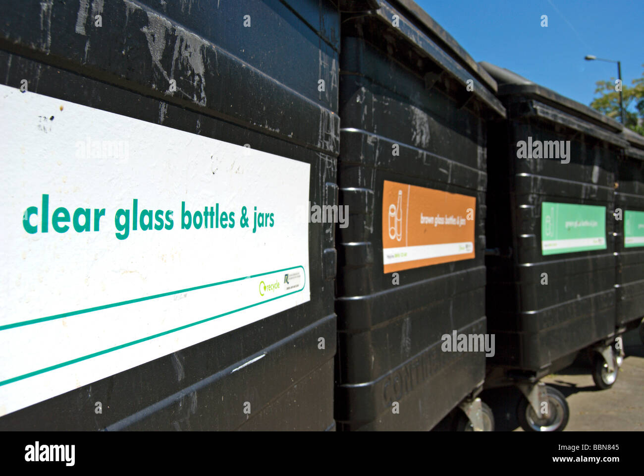 british black recycling bins, the first labelled clear glass bottles