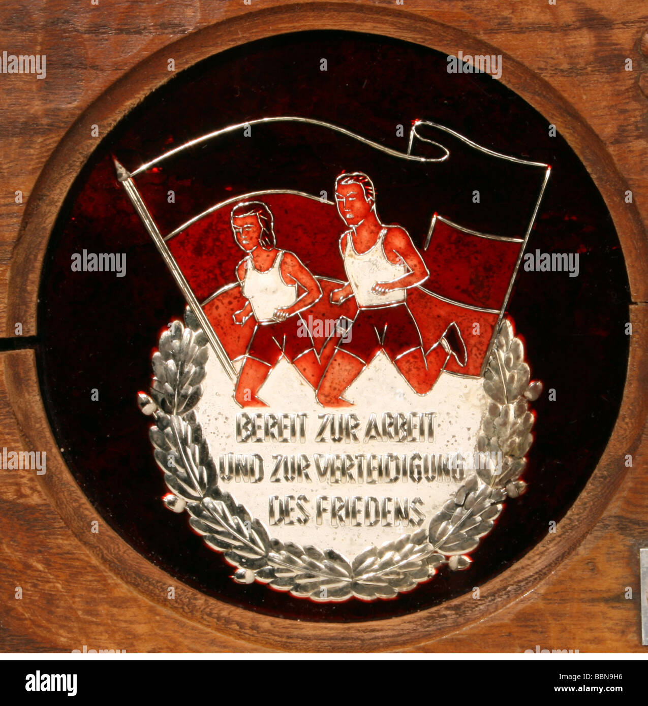 decorations, wooden plate with application 'Der besten Gemeinschaft Klasse II Rund um Berlin Sektion Radsport der DDR Gross-Berlin 1953', winner sports championship, detail motive, Stock Photo