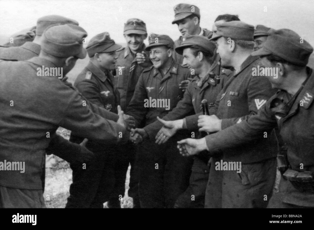 events, Second World War / WWII, Russia 1944 / 1945, Crimea, Sevastopol, soldiers of a Luftwaffe anti-aircraft unit congratulating a comrade on the award of a medal, 30.4.1944, Eastern Front, USSR, Wehrmacht, 20th century, historic, historical, Soviet Union, AA, joy, handshake, shaking hands, laughing, 1940s, people, Stock Photo