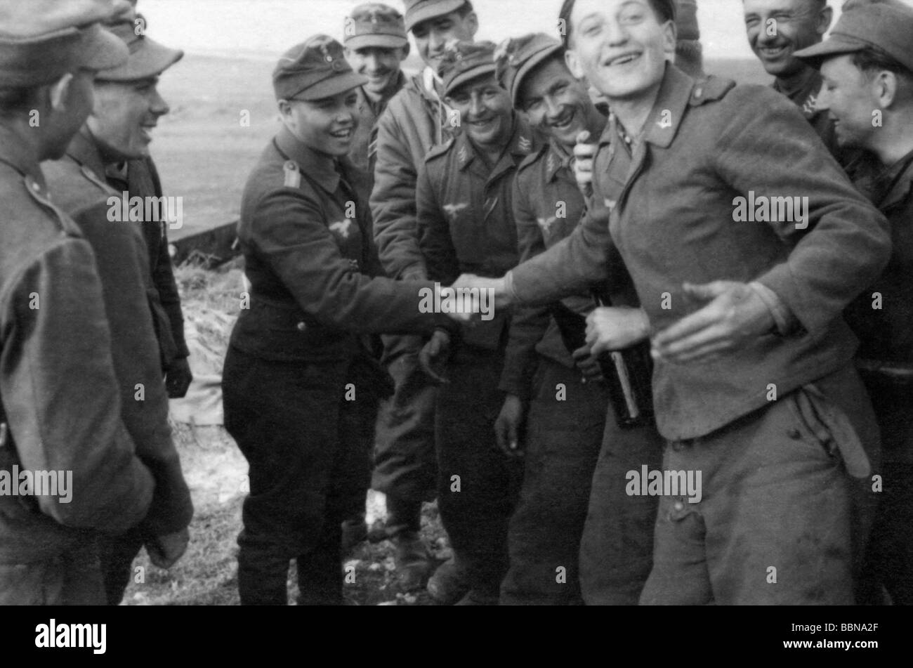events, Second World War / WWII, Russia 1944 / 1945, Crimea, Sevastopol, soldiers of a Luftwaffe anti-aircraft unit congratulating a comrade on the award of a medal, 30.4.1944, Eastern Front, USSR, Wehrmacht, 20th century, historic, historical, Soviet Union, AA, joy, handshake, shaking hands, laughing, 1940s, people, Stock Photo
