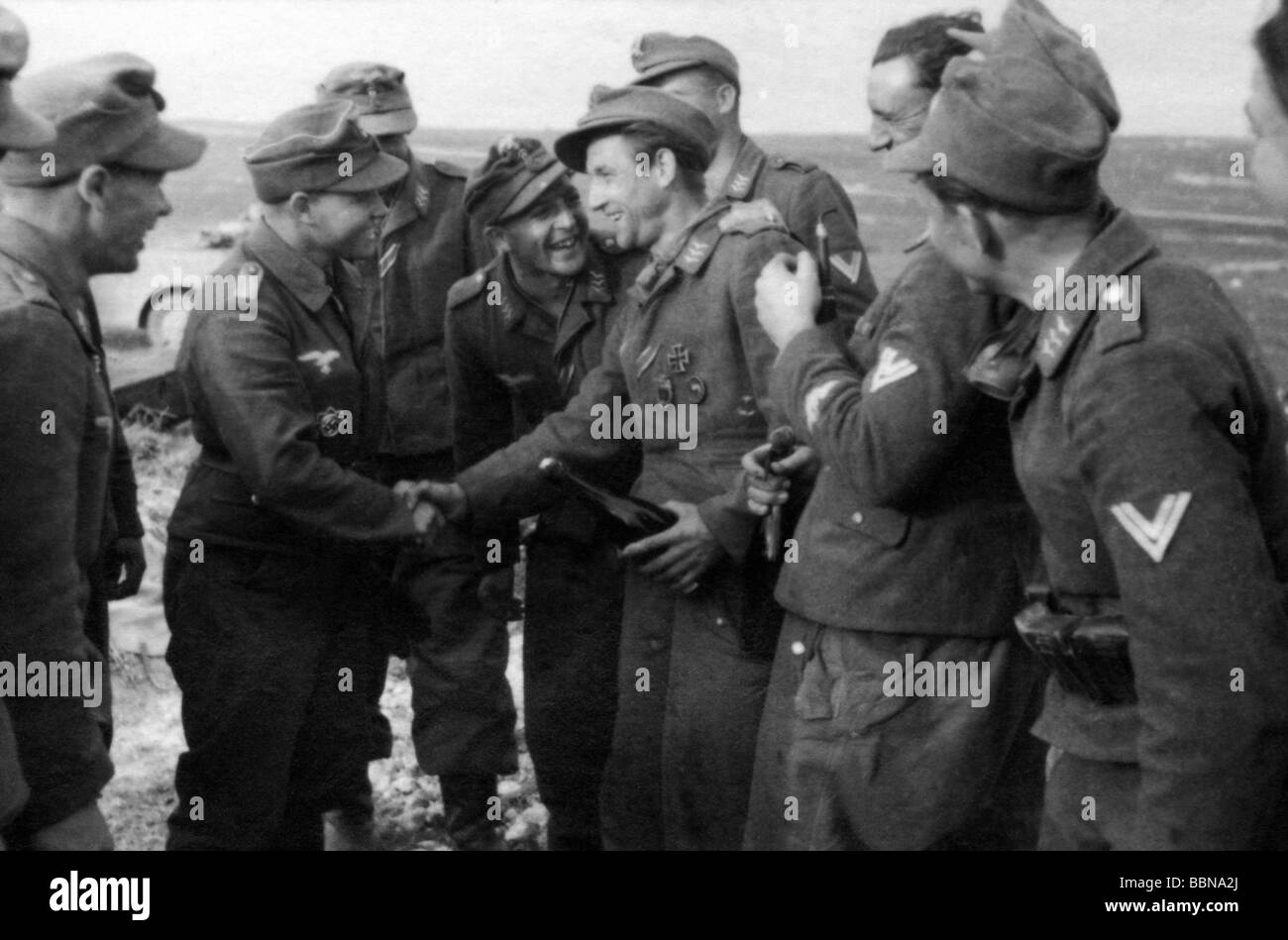 events, Second World War / WWII, Russia 1944 / 1945, Crimea, Sevastopol, soldiers of a Luftwaffe anti-aircraft unit congratulating a comrade on the award of a medal, 30.4.1944, Eastern Front, USSR, Wehrmacht, 20th century, historic, historical, Soviet Union, AA, joy, handshake, shaking hands, laughing, 1940s, people, Stock Photo