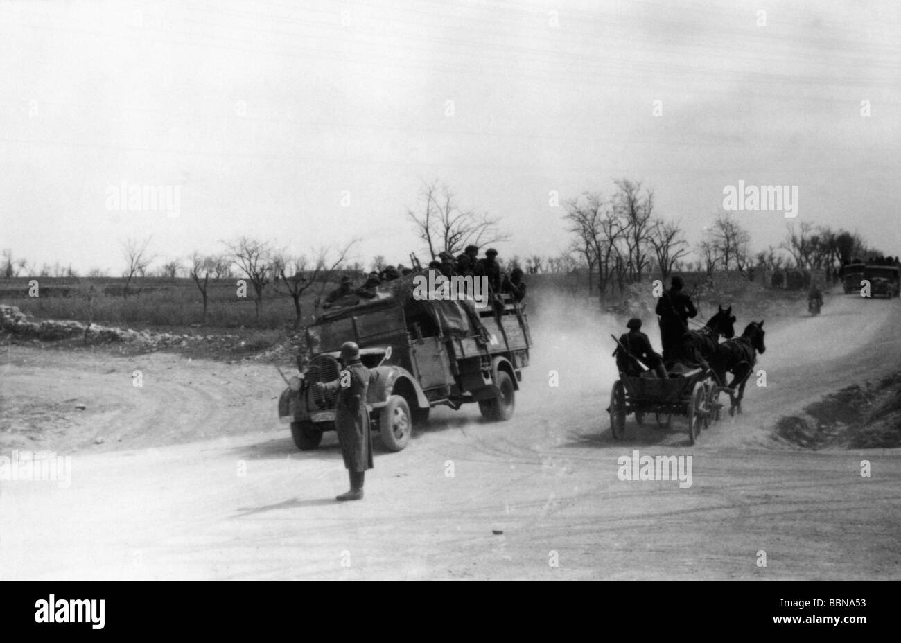 events, Second World War / WWII, Russia 1944 / 1945, Crimea, German soldier regulating the traffic on a crossroad near Sevastopol, April 1944, vehicle, vehicles, 20th century, historic, historical, Eastern Front, USSR, Soviet Union, road, lorry, horse and cart, Wehrmacht, Third Reich, military, 1940s, people, Stock Photo