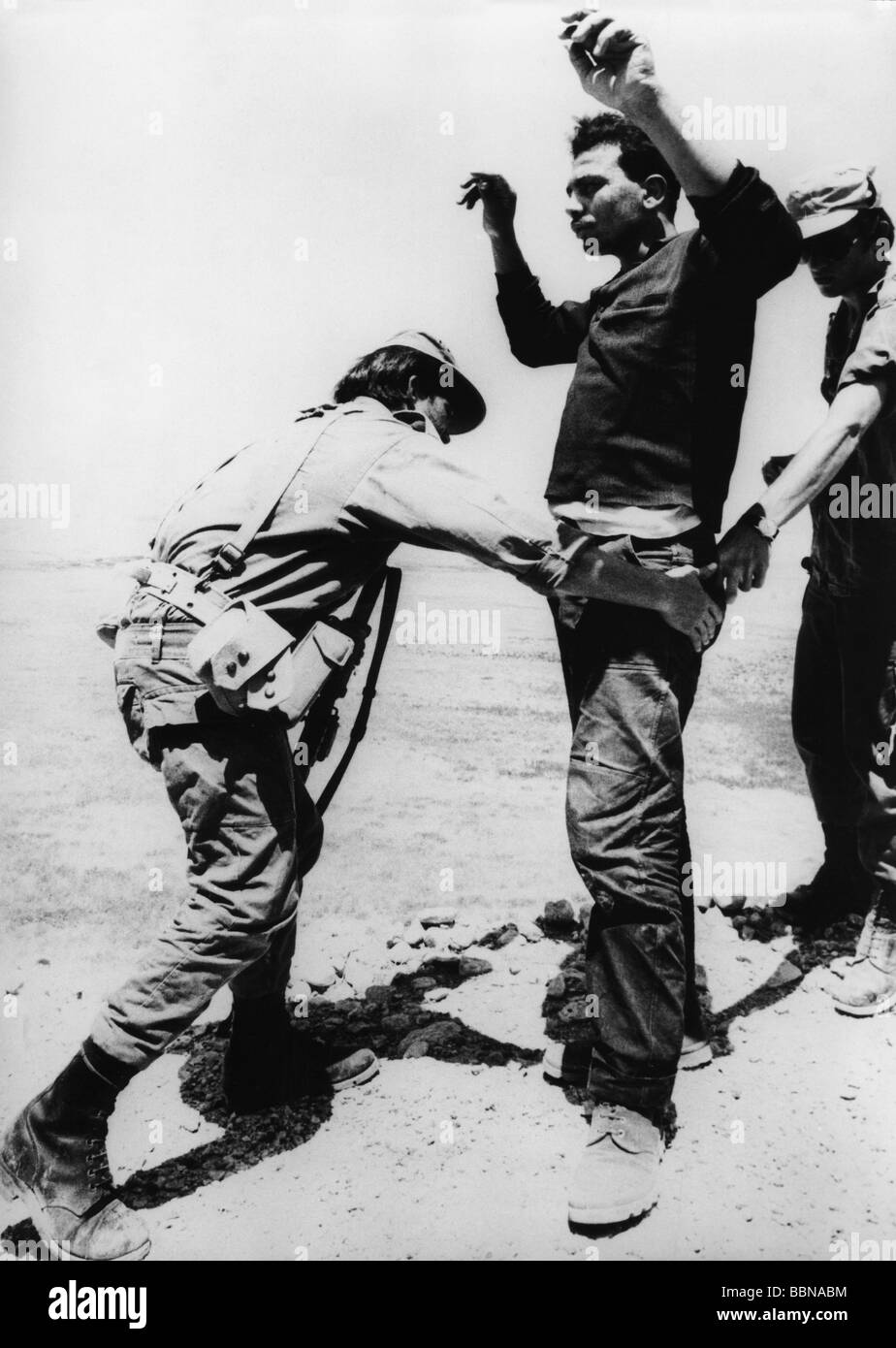 geography / travel, Israel, military, soldier frisking a Palestinian defector from Jordan, Southern Jordan River Valley, 24.7.1971, Stock Photo