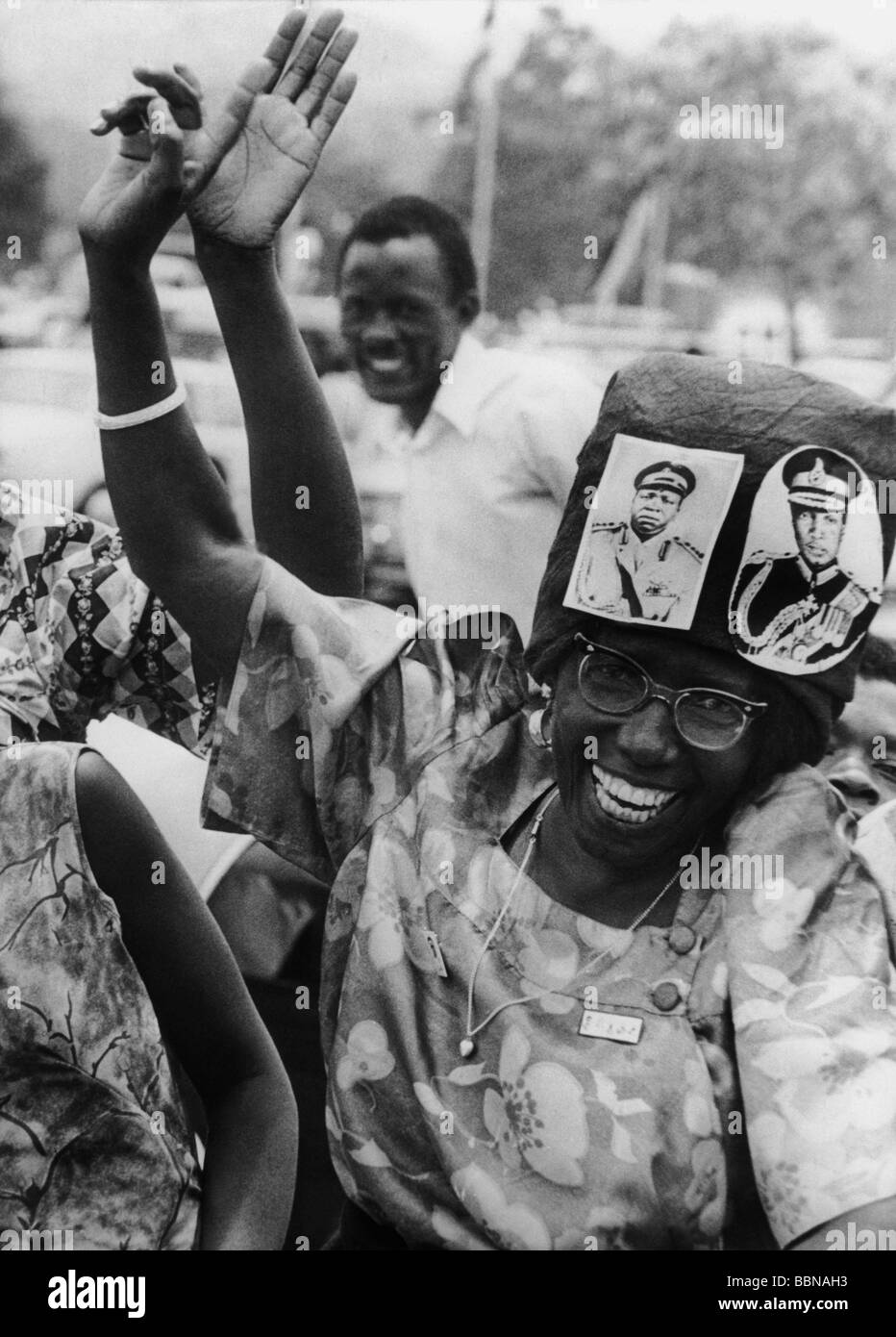 Uganda, politics, cheering woman with photos of Idi Amin Dada and Sir Edward Mutasa at her hat, Kampala, 12.2.1971, Stock Photo