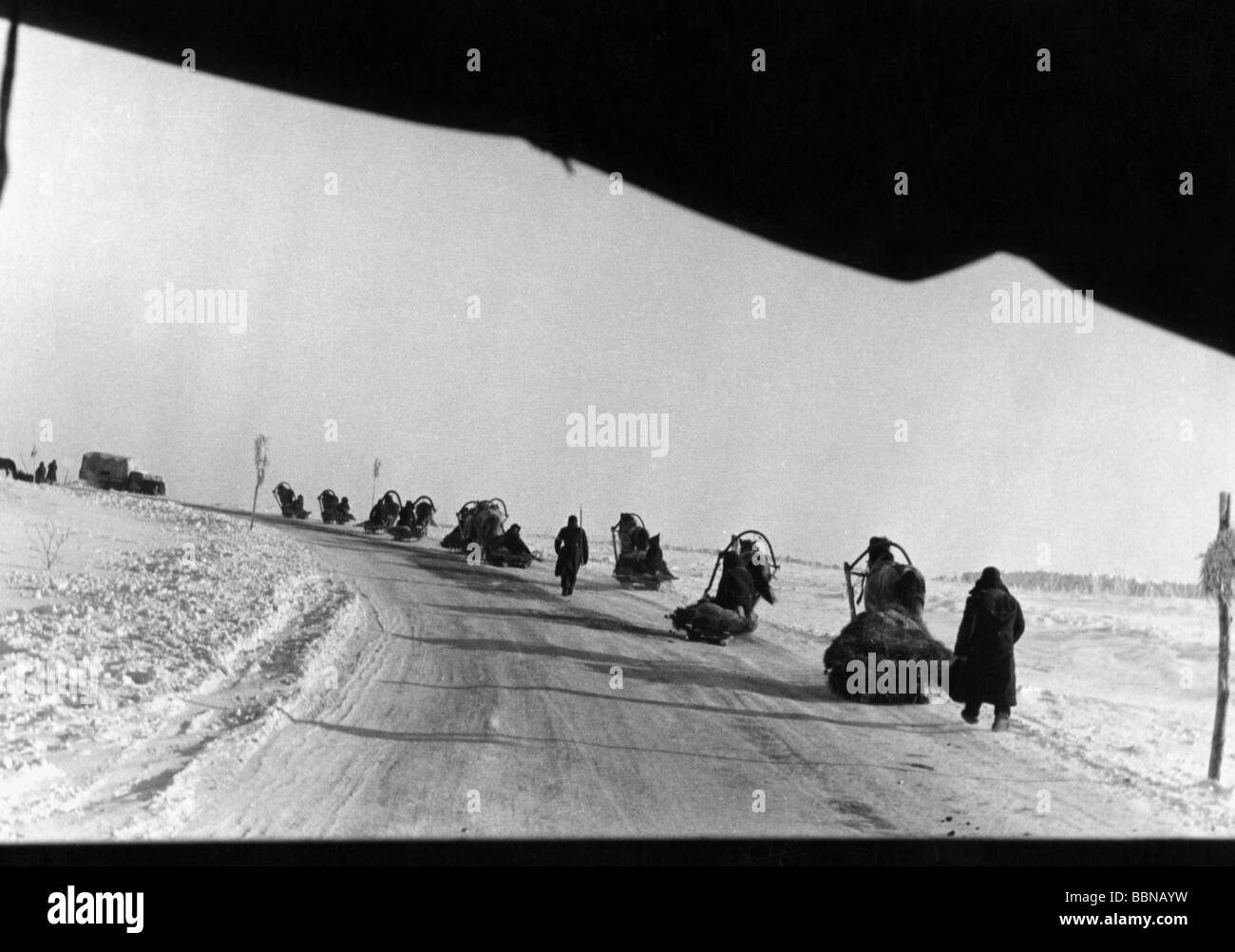 events, Second World War / WWII, Russia 1942 / 1943, German supply column with sleighs on the Eastern Front, circa 1942, Wehrmacht, USSR, Soviet Union, Third Reich, military, snow, winter, cold, coldness, frost, 20th century, historic, historical, soldiers, horses, sleigh, lorry, people, 1940s, Stock Photo
