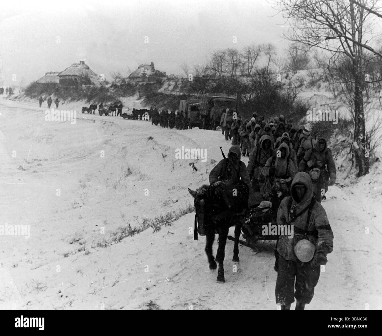 events, Second World War / WWII, Russia 1944 / 1945, German column on a road near Britskoye, Ukraine, late January 1944, infantry, march, winter clothes, clothing, snow suit, suits, sleigh, Eastern Front, Wehrmacht, Soviet Union, USSR, Army Group South, Third Reich, 20th century, historic, historical, vehicles, lorries, 1940s, people, Stock Photo