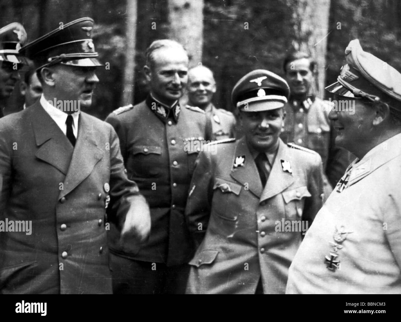 Hitler, Adolf, 20.4.1889 - 30.4.1945, German politician (NSDAP), Chancellor since 30.1.1933, with SS Gruppenfuehrer Karl Wolff, Martin Bormann, Hermann Goering, Fuehrer Headquarters 'Wolfsschanze', 1942, near Rastenburg, East Prussia, half length, Stock Photo