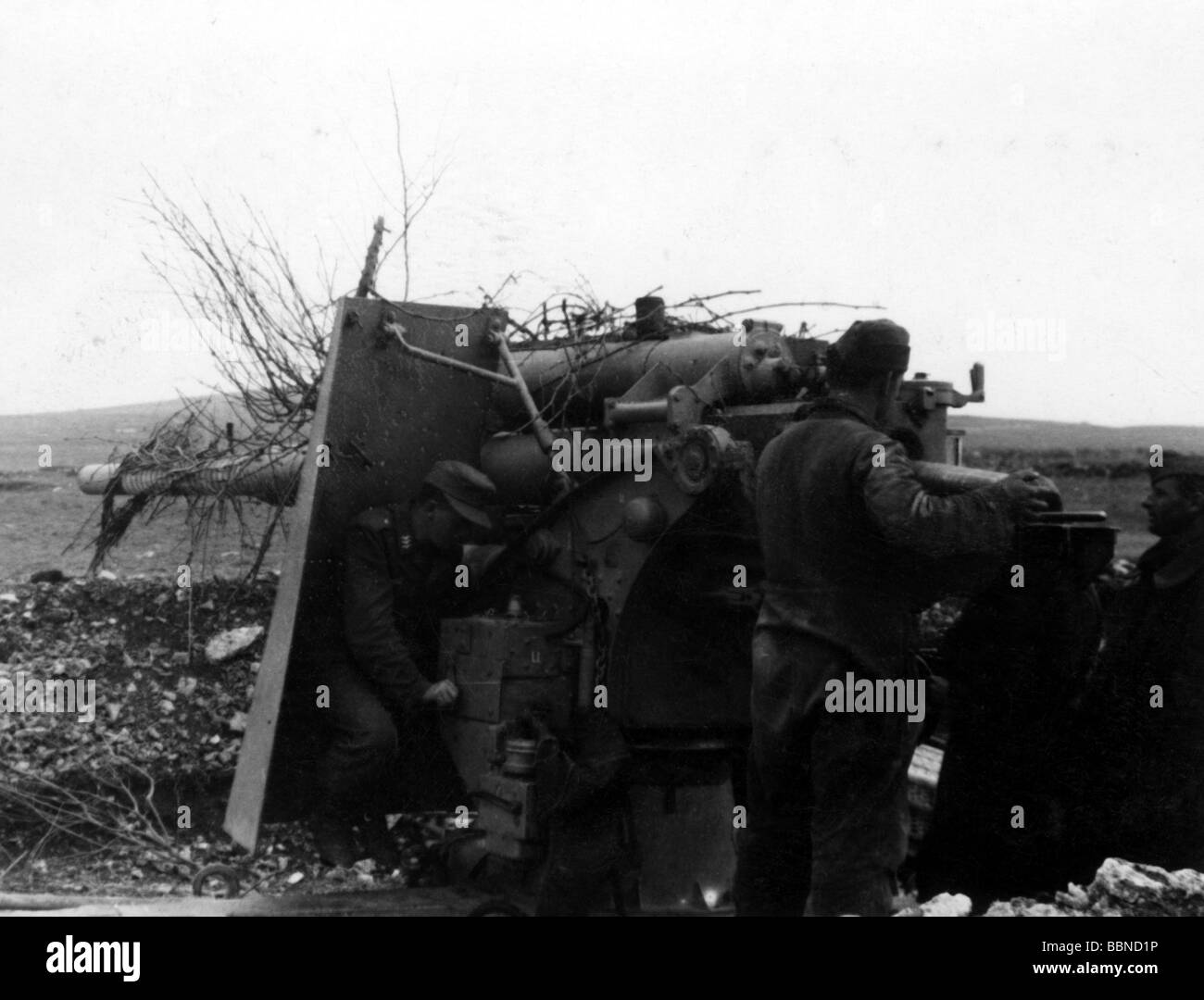 events, Second World War / WWII, Russia 1944 / 1945, Crimea, Sevastopol, German 88 mm anti-aircraft gun Flak 36/37 in firing position against ground targets, assistant gunner loading, 30.4.1944, Eastern Front, USSR, Wehrmacht, Luftwaffe, AA, guns, artillery, emplacement, gunners, gunner, shell, shield, 20th century, historic, historical, Soviet Union, soldiers, crew, 8.8 cm, people, 1940s, Stock Photo