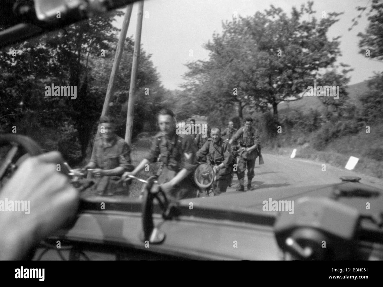 events, Second World War / WWII, France, German occupation, Wehrmacht car passing a group of German soldiers with bicycles, 20th century, historic, historical, Southern France, Third Reich, people, 1940s, Stock Photo