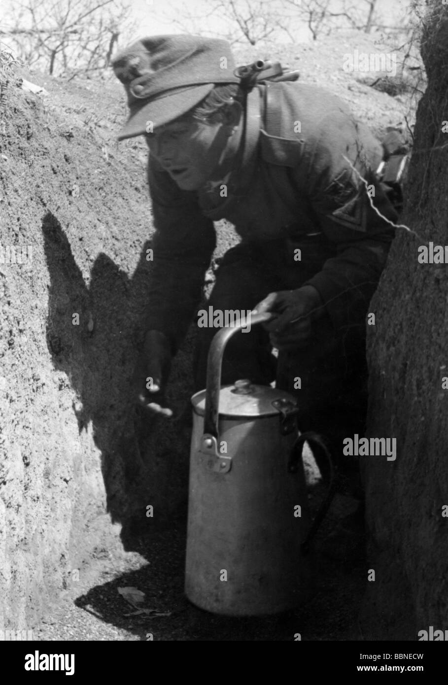 events, Second World War / WWII, Russia 1944 / 1945, Crimea, Sevastopol, German soldier bringing food to his comrades in a dugout at the main front, 26.4.1944, field cap, trench, Eastern Front, USSR, Wehrmacht, 20th century, historic, historical, uniform, uniforms, infantry, Obergefreiter, can, pot, people, 1940s, Stock Photo