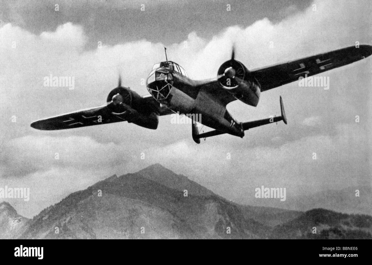 events, Second World War / WWII, aerial warfare, aircraft, German bomber Dornier Do 17 in flight, photo postcard, Germany, circa 1940, Do-17, Do17, Do 215, Do-215, Do215, bombers, flying, clouds, mountains, 20th century, historic, historical, Luftwaffe, Wehrmacht, Germany, Third Reich, plane, planes, postcards, 1940s, Stock Photo