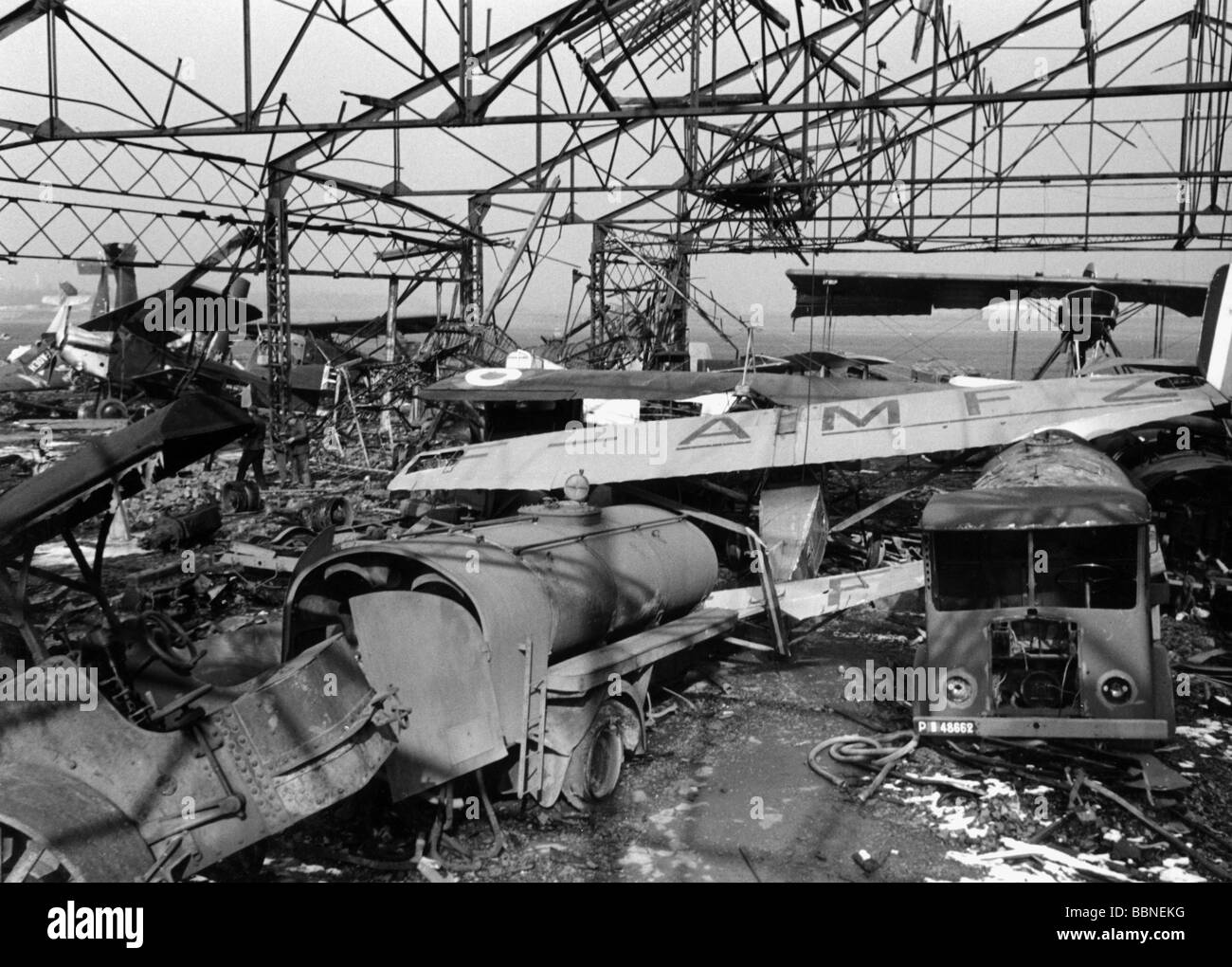 events, Second World War / WWII, aerial warfare, France 1942 / 1943, airfield St. Cyr after a bombing raid, destroyed planes and fuelling vehicles, circa 1942, 20th century, historic, historical, bomb war, wreckage, wreck, wrecks, destruction, airport, hangar, tank lorry, lorries, 1940s, Stock Photo