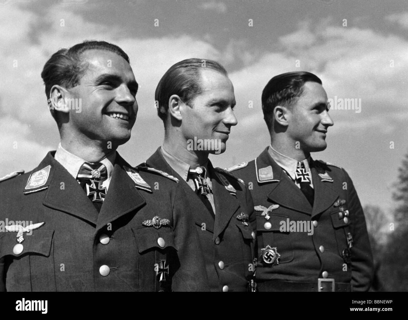 events, Second World War / WWII, aerial warfare, persons, Luftwaffe officers, Kampfgeschwader (bomber wing) 6, Creil, France, 13.4.1943, from left to right: Oberstleutnant (lieutenant colonel) Walter Storp (wing commander), Major Hermann Hogeback (group commander), Oberleutnant (first lieutenant) Rudolf Puchinger (squadron leader), Third Reich, uniform, uniforms, Wehrmacht, officer, soldier, soldiers, pilot, pilots, holder of the Knight's Cross with oak leaves, oakleaves, holders, medal, medals, KG, half length, smiling, laughing, propaganda photo, 20th century, Stock Photo