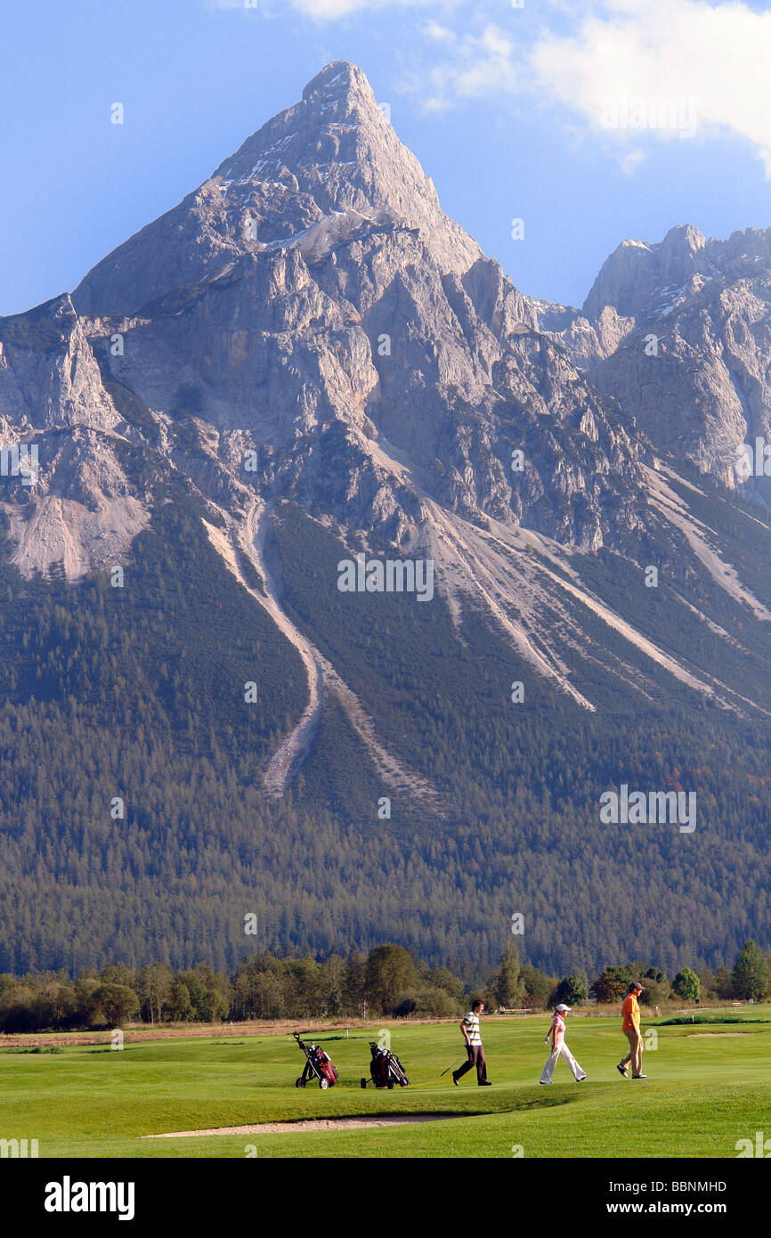geography / travel, Austria, Tyrol, Ehrwald, playing Golf with Sonnenspitze and Grunstein Mountains in the background, Additional-Rights-Clearance-Info-Not-Available Stock Photo