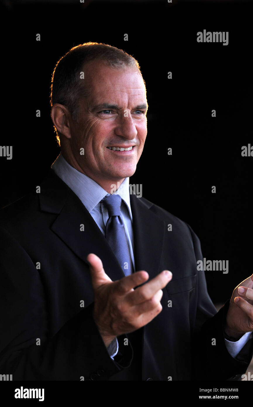 A man in his 40's public speaking. Stock Photo