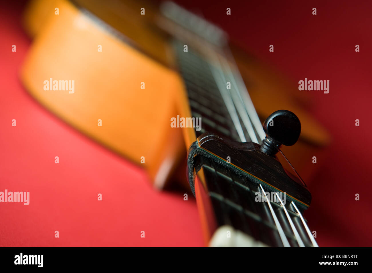Flamenco guitar showing capo and strings Stock Photo Alamy