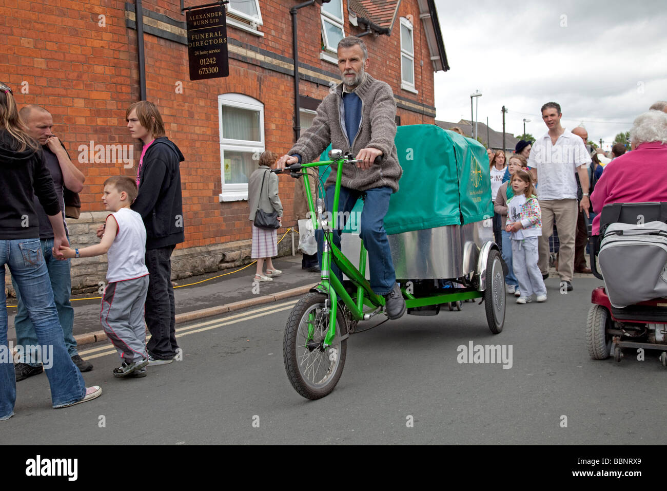 Man riding Green Cross Coop delivery tricycle trike Cleeve