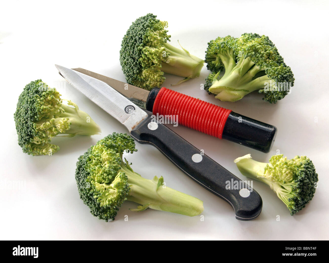 https://c8.alamy.com/comp/BBNT4F/fresh-broccoli-with-a-vegetable-knife-and-peeler-BBNT4F.jpg