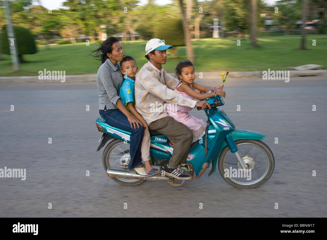 Siem Reap,Cambodia;Family riding on a scooter together without safety helmets Stock Photo