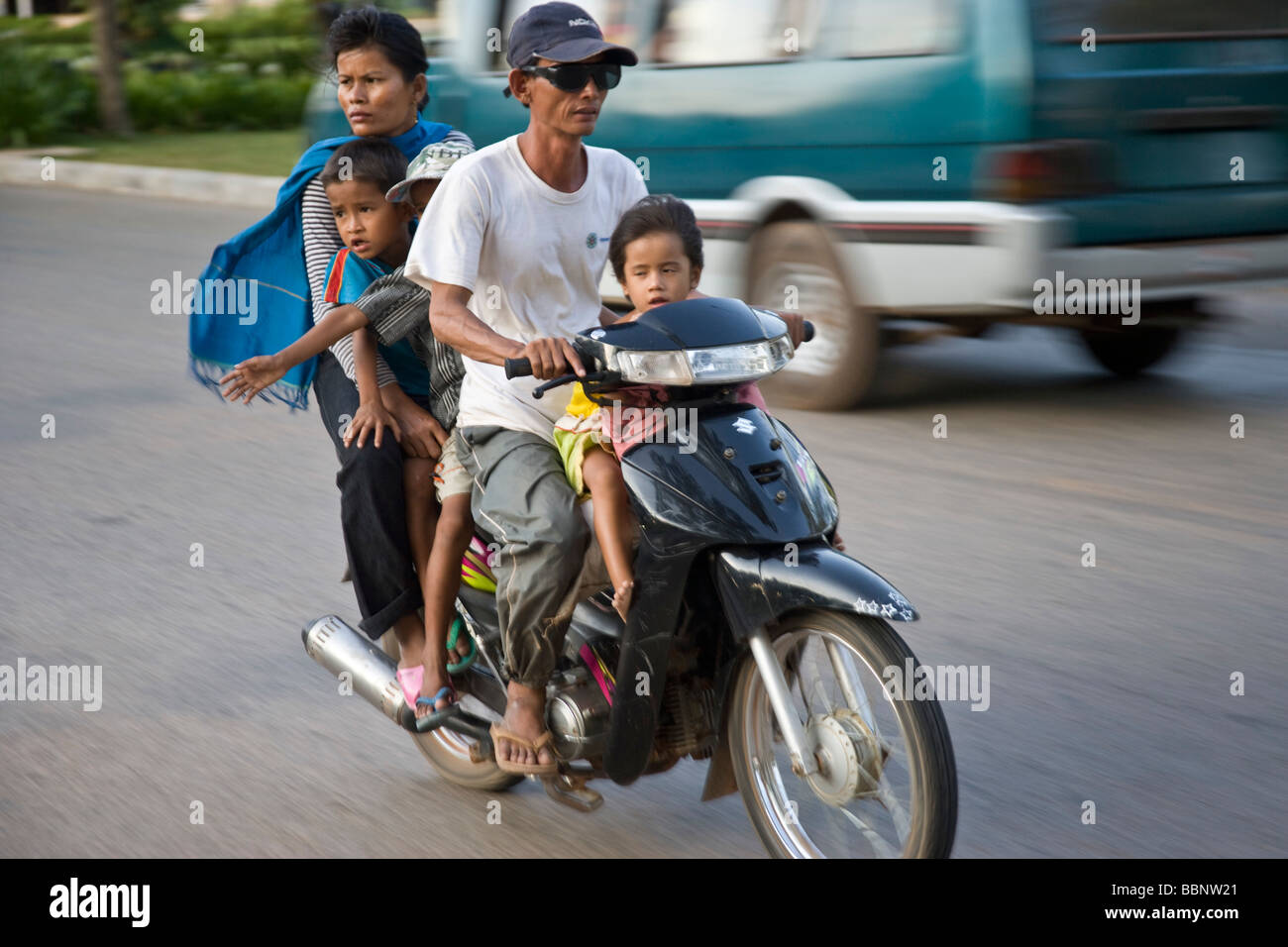 Siem Reap,Cambodia;Family riding on a scooter together without safety helmets Stock Photo