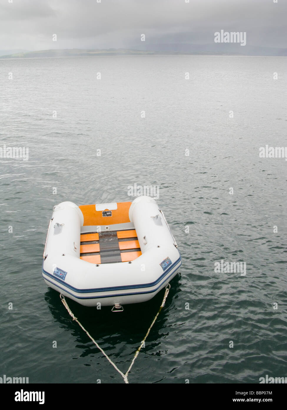 Dinghy on calm sea Stock Photo Alamy