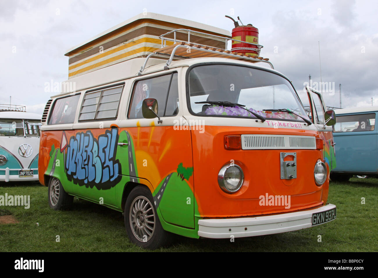 Orange and white VW camper van Stock Photo