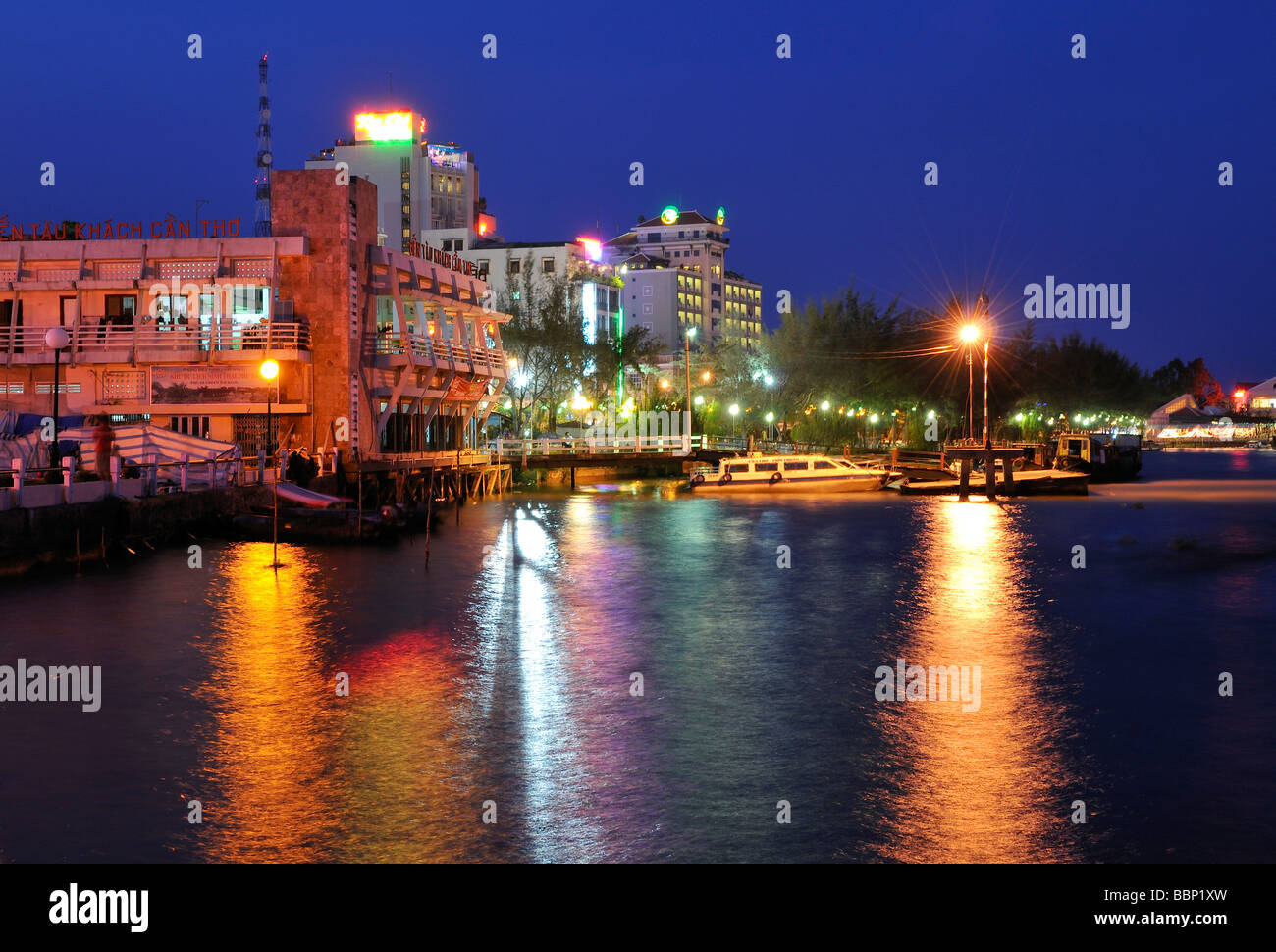 Lighted Houses in Can Tho in the evening reflections on the Mekong, Mekong Delta, Vietnam, Southeast Asia Stock Photo