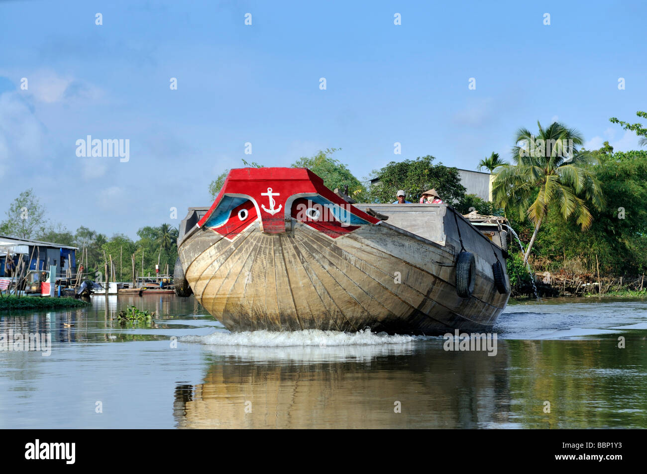 Boat with traditional ornamental painting on the bow, eyes, on the Mekong, Vietnam, Southeast Asia Stock Photo