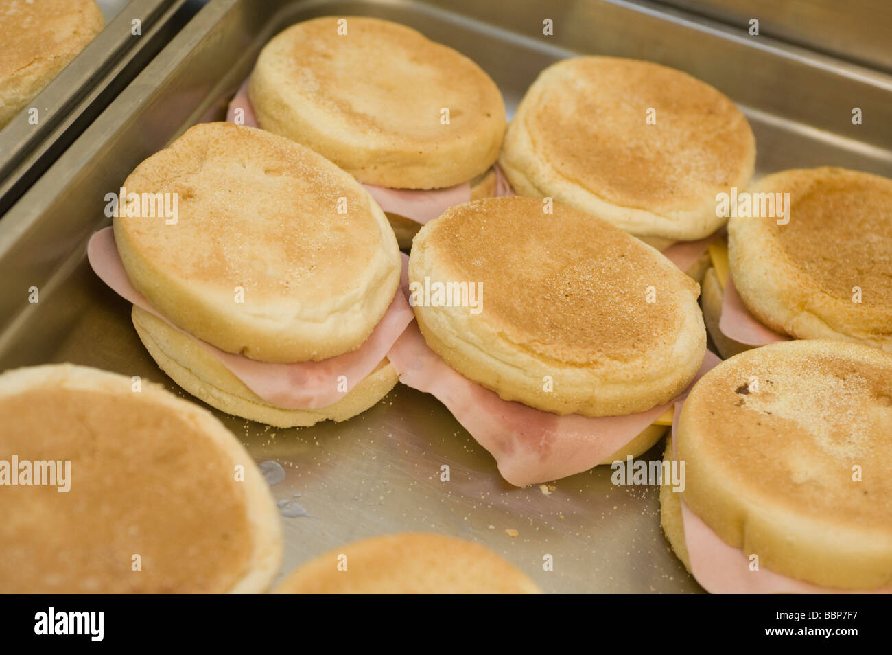 Tray full of cheese and ham muffins in a canteen Stock Photo