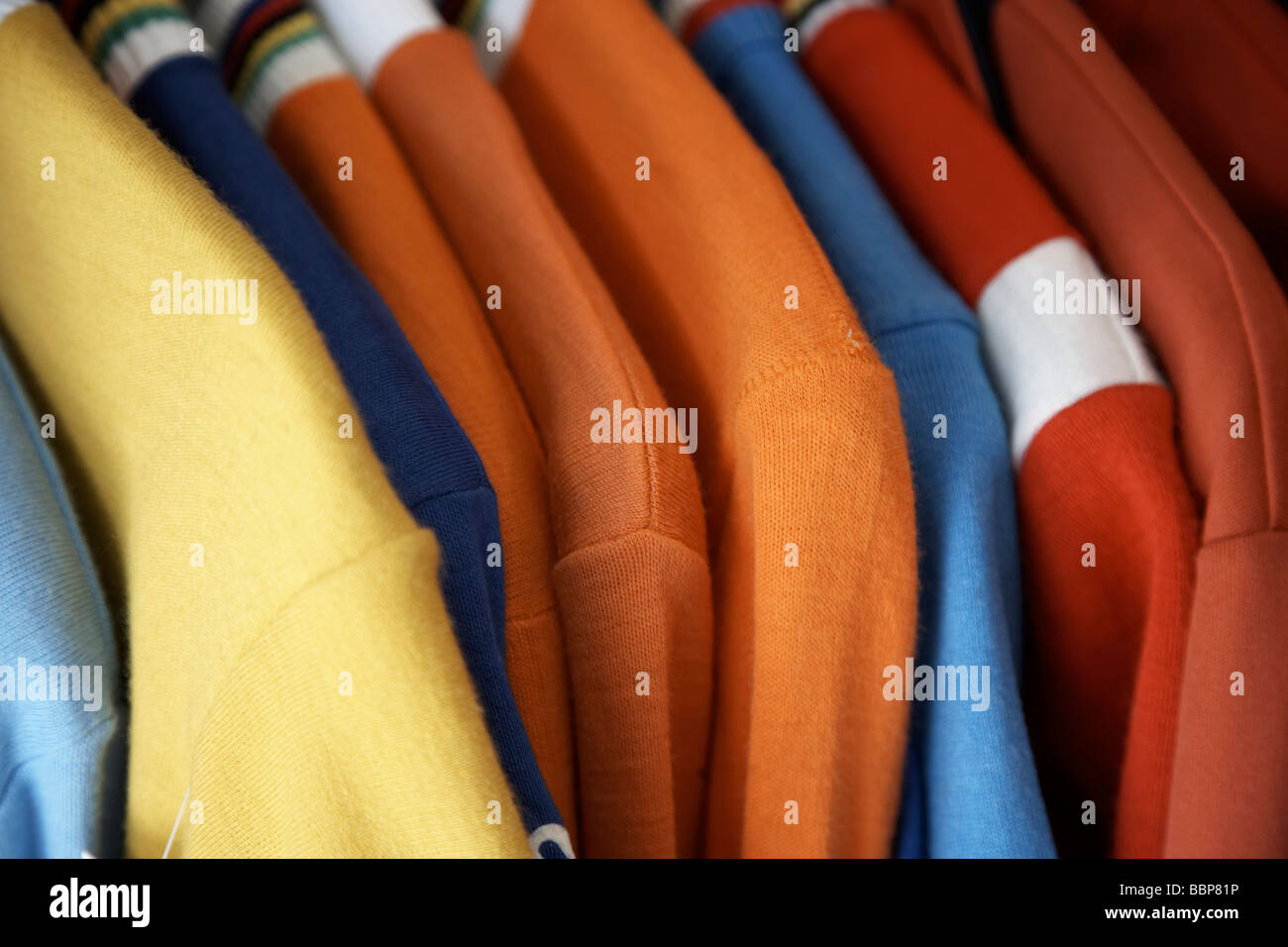 Close up of clothes on a rail in vintage secondhand shop Stock Photo