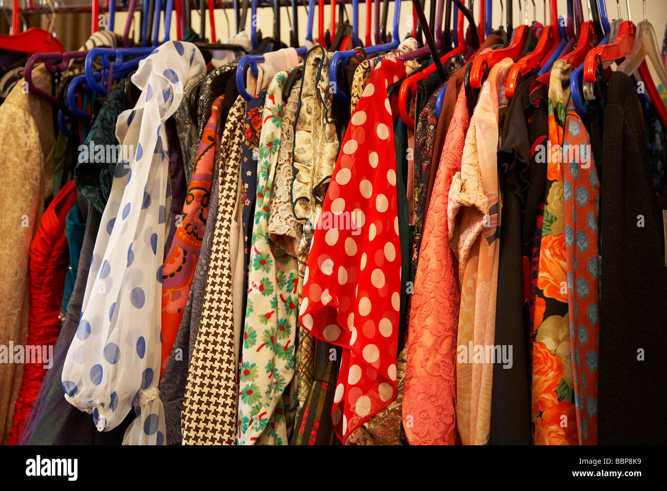 Clothes for sale, in secondhand shop Stock Photo