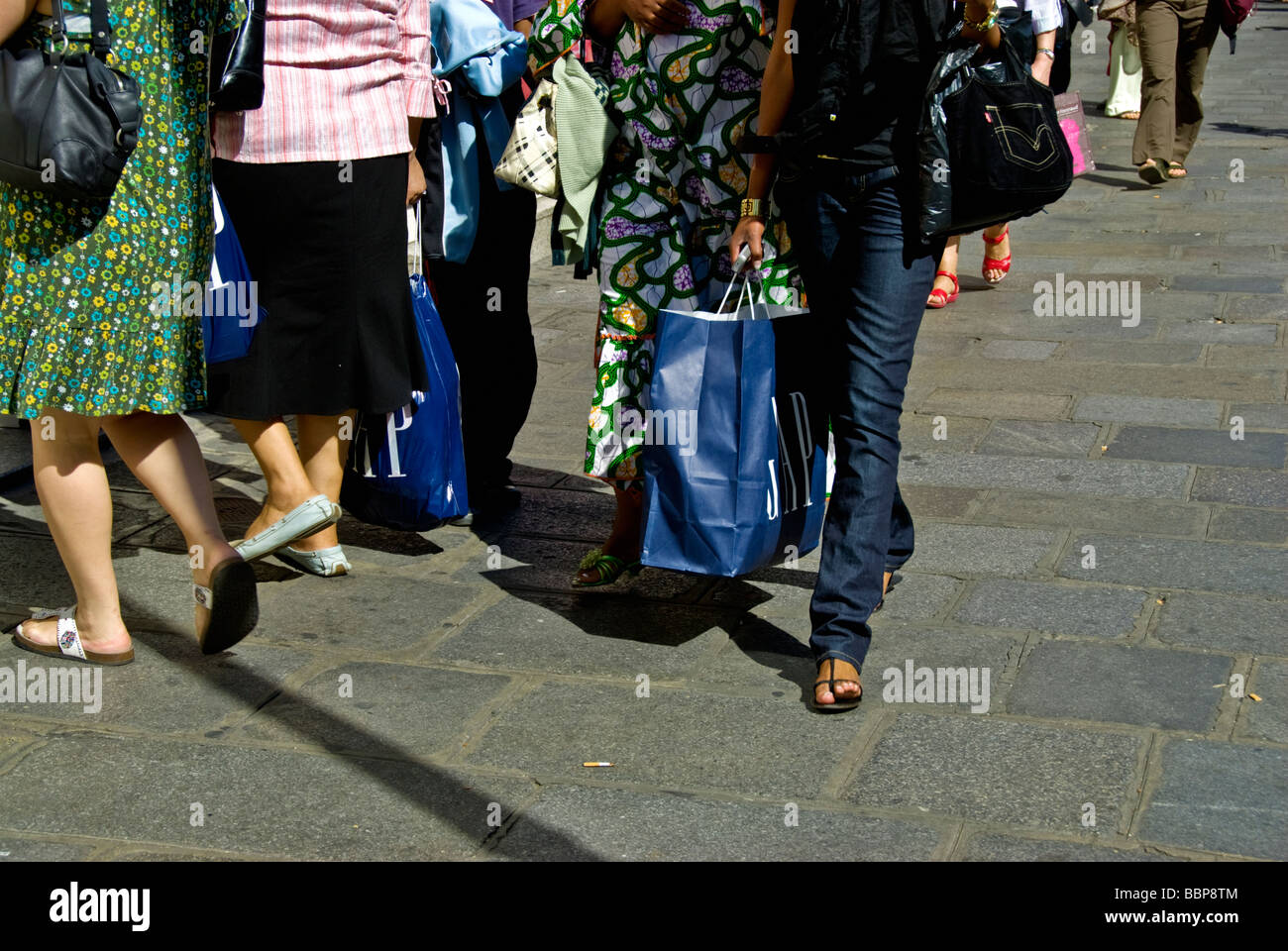 Paris France, Shopping, Detail, Medium Crowd People, Female Legs, Women Walking, Carrying 'Shopping Bags', street fashion shoes,  tourism fashion Stock Photo