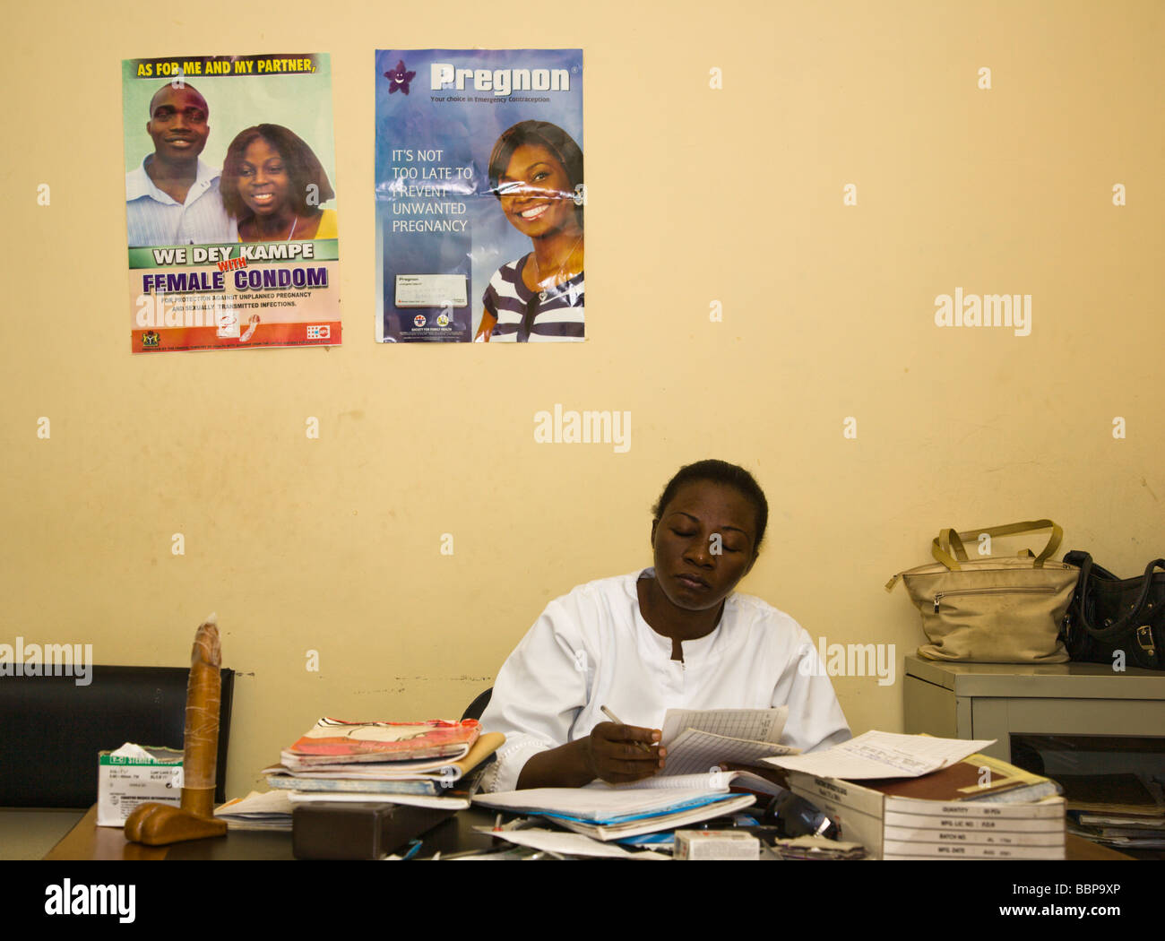 A public family planning clinic in Abuja, Nigeria, displays posters promoting Pregnon emergency contraceptives & female condoms. Stock Photo
